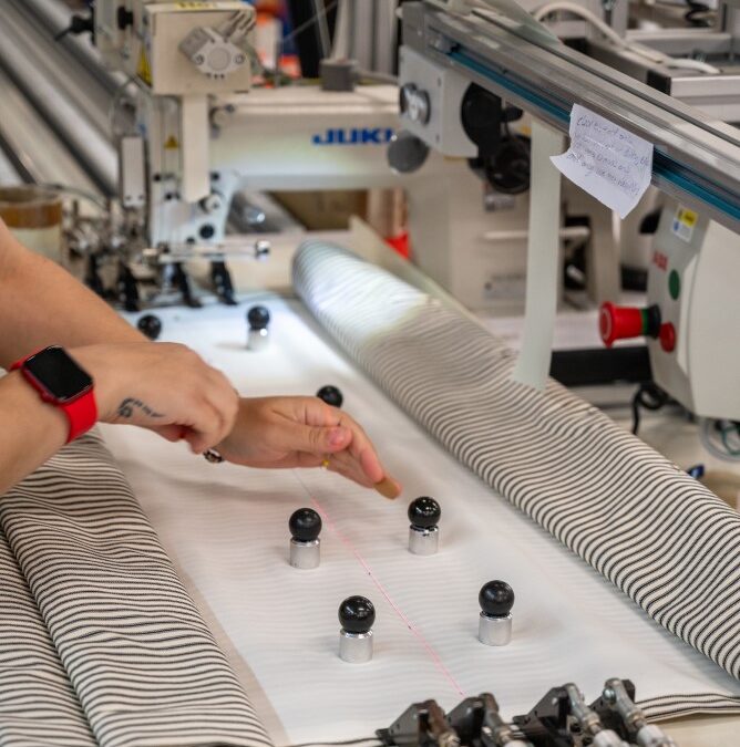 Machine stitching striped fabric for curtain production