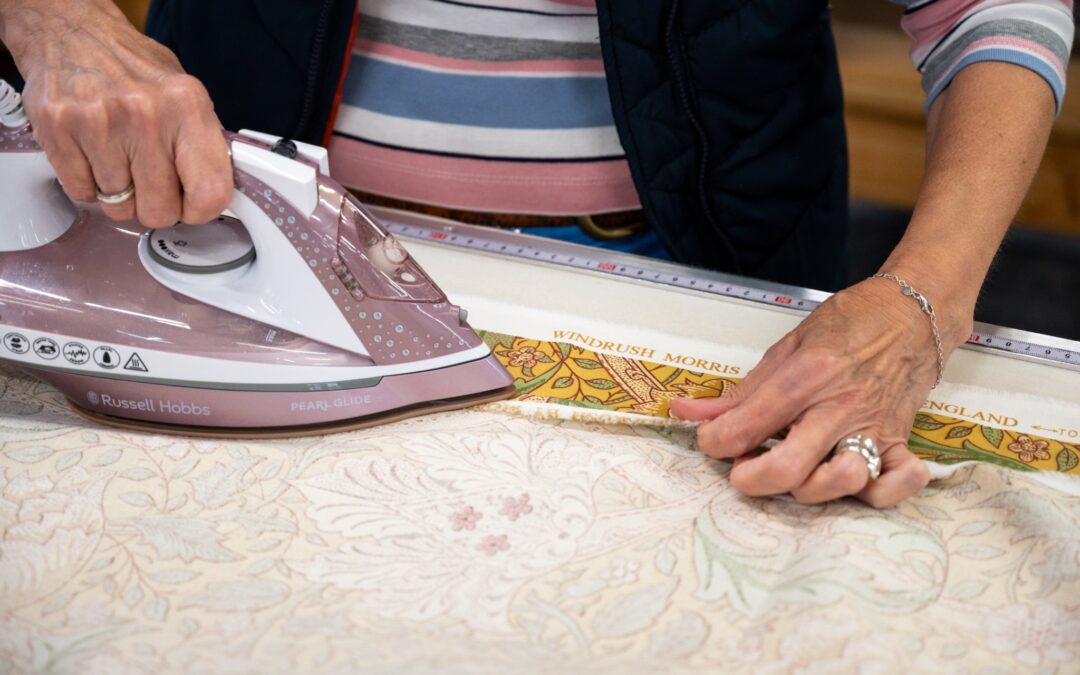 Professional curtain making with precision ironing and measuring